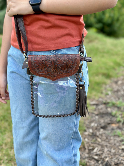 Handcrafted clear crossbody bag with genuine tooled leather accents. Stadium-approved western concert purse, perfect for rodeos, games, festivals, and everyday use.
