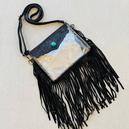 Stadium-approved clear western crossbody bag with genuine leather fringe, turquoise stone accent, adjustable strap, and zip closure for concerts, rodeos, and festivals.