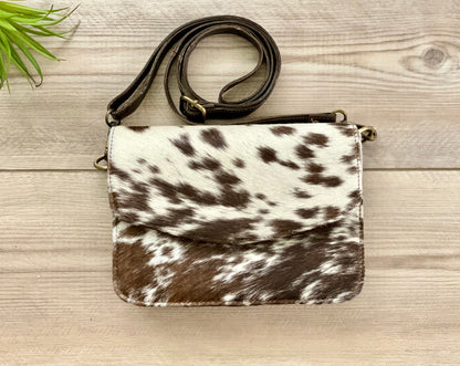 Handcrafted genuine cowhide leather crossbody purse with adjustable strap, western hair-on-hide handbag for rodeos, festivals, concerts, and everyday wear.