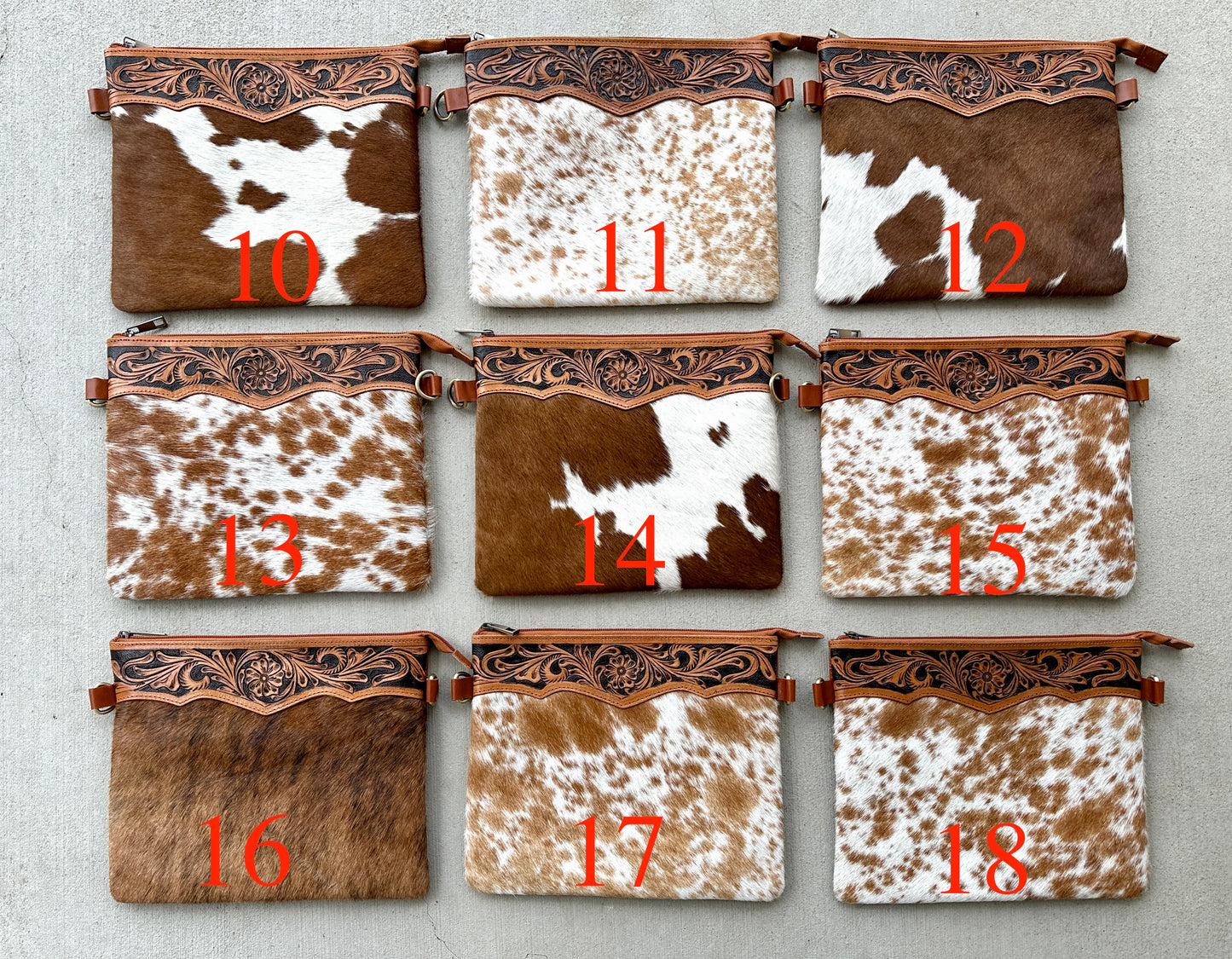 Handcrafted genuine cowhide crossbody purse with floral tooled leather zipper accent, adjustable leather strap, and western hair-on-hide design for everyday wear and rodeos.